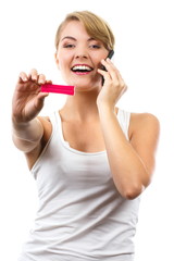 Happy woman with phone informing someone about positive pregnancy test