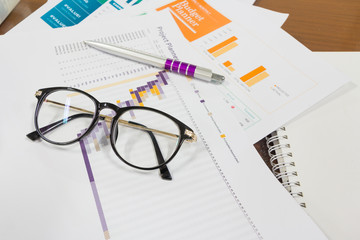 Analysis chart and paperwork on office table