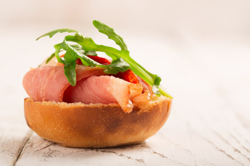 Sandwich with duck breast and arugula