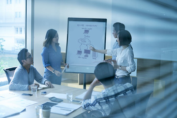 Business team discussing drawing of new project