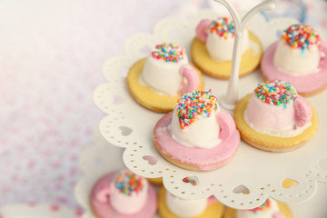 Fototapeta na wymiar Marshmallow tea cups biscuits, tea party
