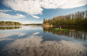 Kayaker on the lake, paddling, active lifestyle