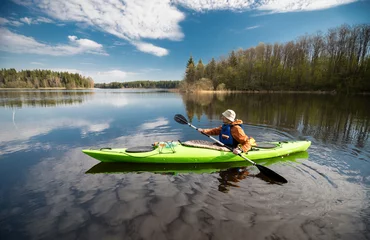 Foto op Canvas Kayaker on the lake, paddling, active lifestyle © zinaidasopina112