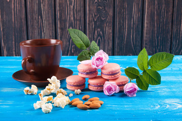 Multicolored macaroon on blue boards.
