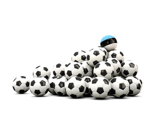 Pile of soccer balls with flag of estonia