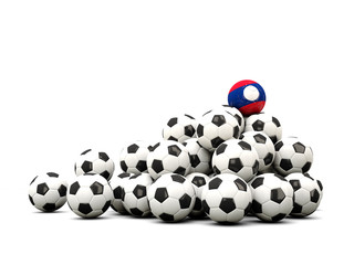 Pile of soccer balls with flag of laos