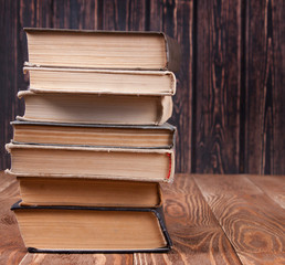 Fototapeta premium Old books on wood desk
