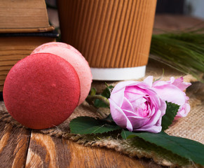 Cup of coffee and macaroon on the boards.