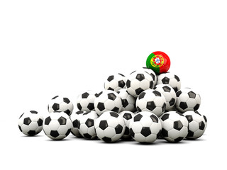 Pile of soccer balls with flag of portugal