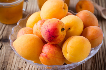 Fresh apricots in glass bowl and homemade apricot chutney