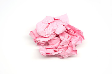 Crumpled pink paper ball isolated on a white background