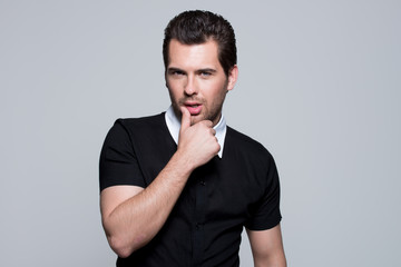 Portrait of young man in black shirt.