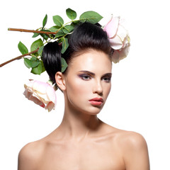 Fototapeta premium Beautiful young woman with flowers in hair.