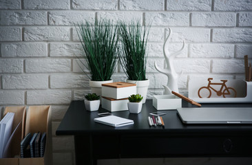 Workplace with laptop on table at home