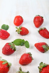 Fototapeta na wymiar Ripe strawberries and mint