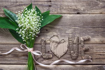 Papier Peint photo Muguet Background with bouquet of  lily of the valley and cardboard let