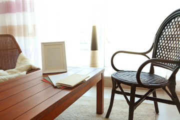 Modern living room interior. Chair beside wooden table.