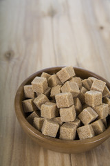Cane sugar in a wooden bowl