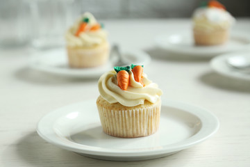 Composition with Easter cupcake on wooden background