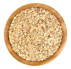 Wooden bowl with oats isolated on white background.