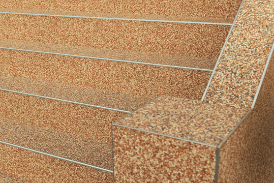 Au&szlig;entreppe und Handlauf in beige mit Kieselbeschichtung im Halbprofil als Querformat    
External stairs and handrail in beige with gravel coating in half-profile as landscape format