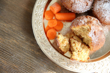Carrot muffins  on a golden plate