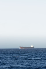 cargo ship sailing in still water