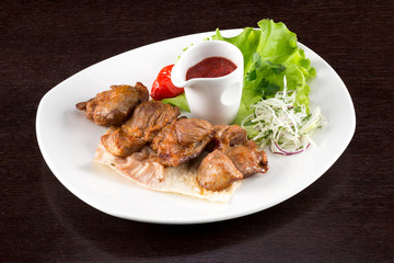 the skewers with sauce on plate
