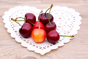 Cherries on Heart-shaped Background