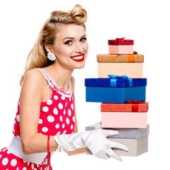 Full body of woman in pin-up style red dress with gift boxes, is