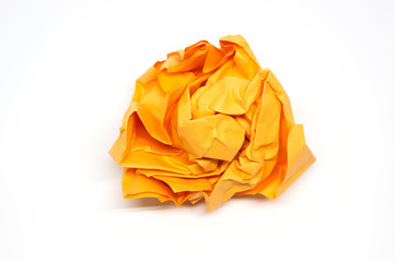 Crumpled orange paper ball isolated on a white background