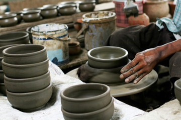 Hands of making clay pot on the pottery wheel,Thailand