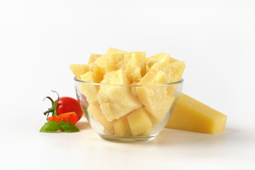 bowl and wedge of parmesan cheese