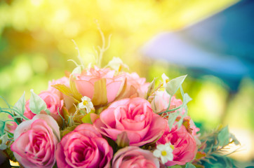 bunch of  pink rose flower on table with nature blur background