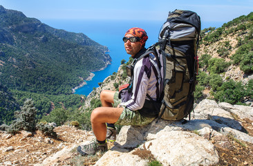 Hiking in Turkey. Lycian Way. Backpacker by the sea.