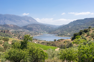 Fototapeta na wymiar The Faneromenis reservoir in the south-central of Crete. The Techniti Limni Faneromenis named in greek, is located in the southern foothills of the Ida mountain massif. Important water supply on Crete