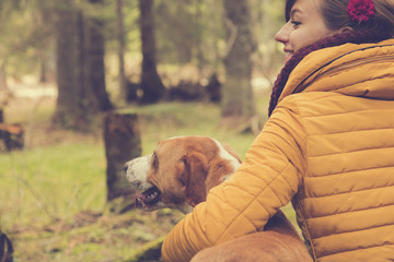Woman with her beautiful dog in nature.
