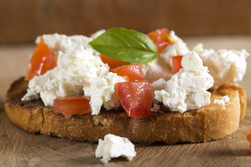 Bruscheta with cheese and tomatoes