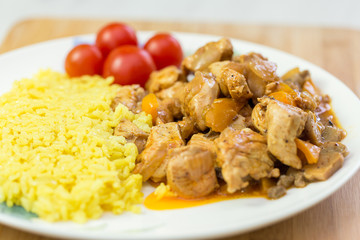 meat and rice with vegetables on dish