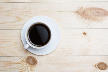 Close up white coffee cup on wooden table