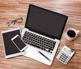 Wood businessman's desk in high definition with laptop, tablet a