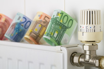 Heizungskosten - Heizung mit Geldscheine