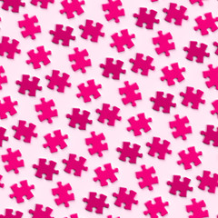 jigsaw puzzle pieces in shades of pink and purple on a surface (seamless)