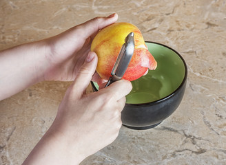 peel-off Apple by hangs on the kitchen table