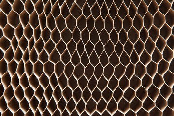 Honeycomb cardboard. Geometric background with copyspace. Recyclable kraft paper cardboard.
