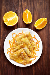 Pancakes on wooden background, top view