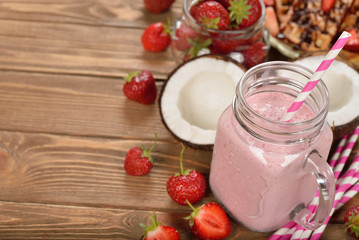 Refreshing cocktail with coconut milk and strawberries