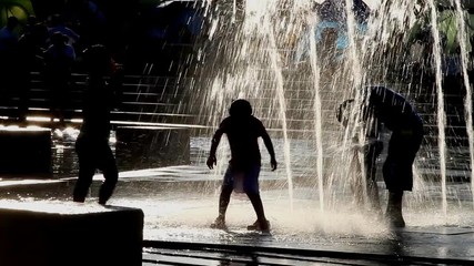 Children playing for fun in water fountains of Hangang(Han river) park in Seoul, South Korea