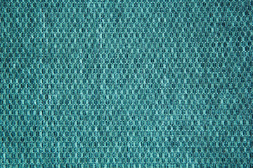 Chess texture fluffy cloth. Mint color background. Fabric background.