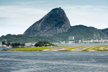 View Of A Passenger Airplane Landing At The Rio De Janeiro Airport With The City At The Background,...